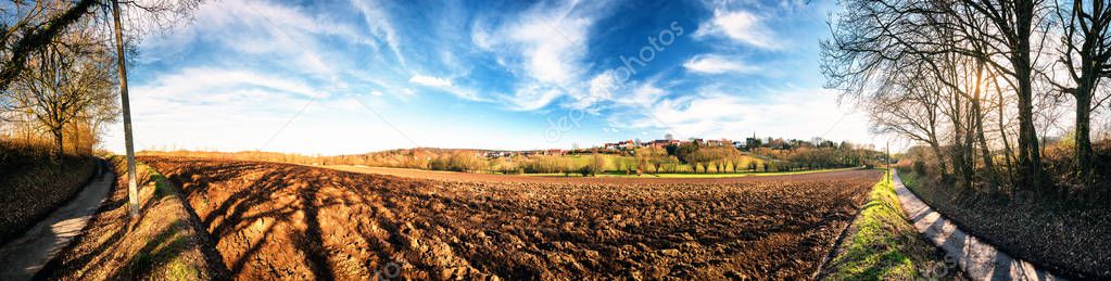 Panoramic agricultural landscape with ploughed field. Country nature background