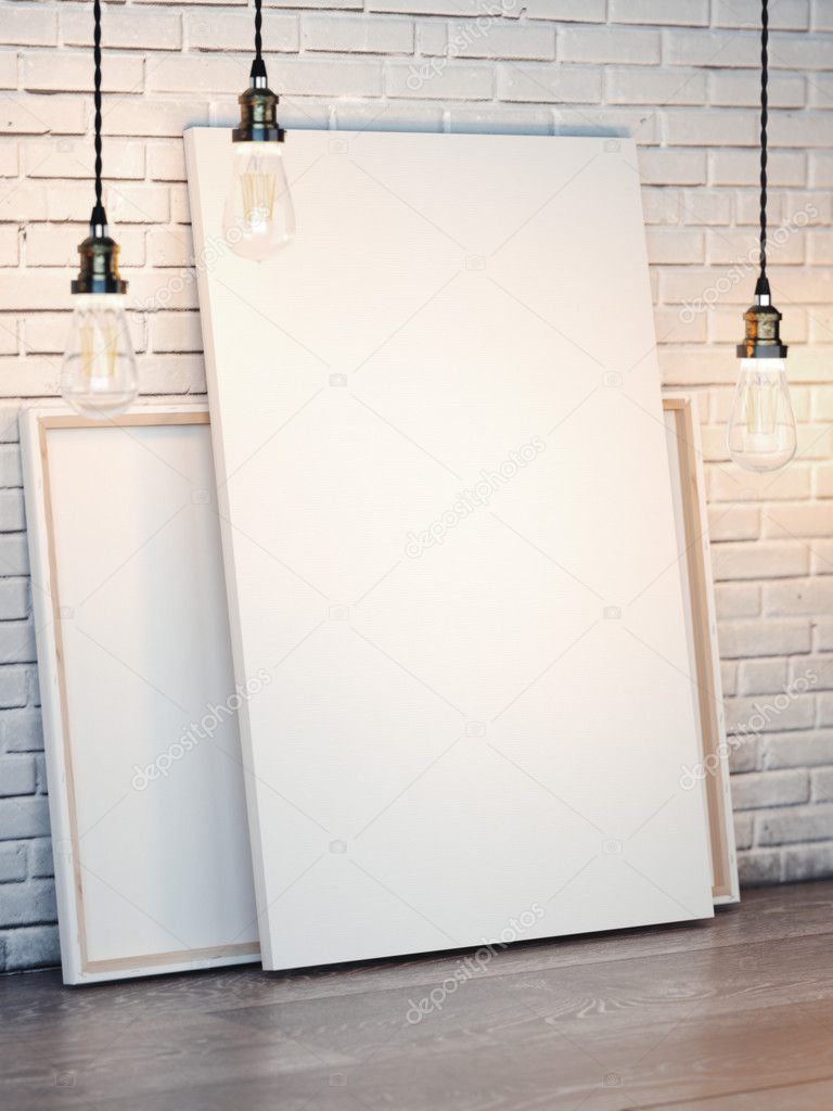 White canvases with bulbs on brick wall. 3d rendering