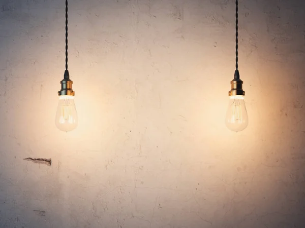 Dos bombillas brillantes y pared de yeso. renderizado 3d — Foto de Stock