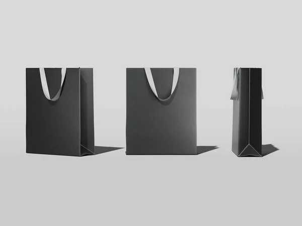 Drie zwarte boodschappentassen. 3D-rendering — Stockfoto