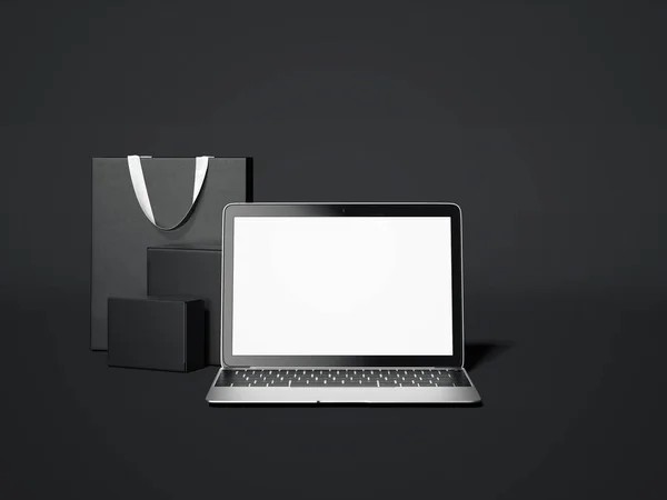 Laptop met geschenkverpakkingen en zak geïsoleerd op donkere achtergrond. 3D-rendering — Stockfoto