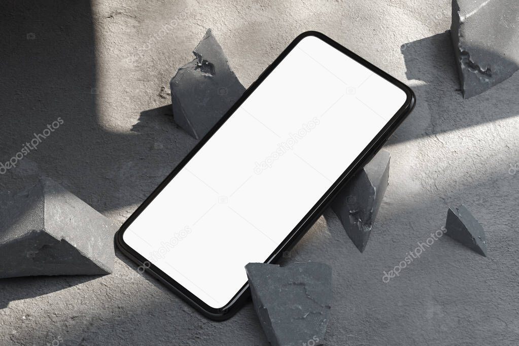 Mobile phone with blank screen near concrete broken forms on concrete floor. 3d rendering.