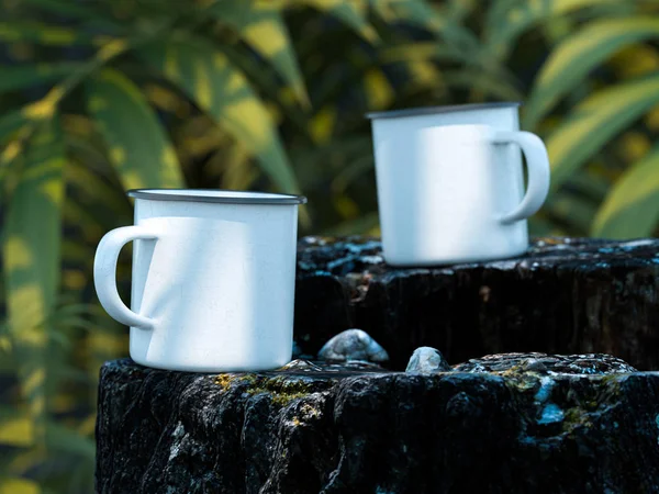 Picnic And Camping Rest of Travelers: White Blank Enameled Mugs With Copy Space On Rock In Exotic Forest (dalam bahasa Inggris). Rendering 3d . — Stok Foto