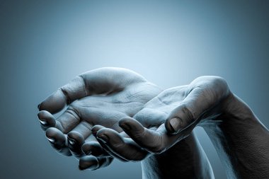Human Hands Folded In Prayer on Gray Background. Concept Of Holy Month of Ramadan Muslims. 3d rendering.