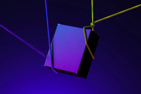 Violet Cardboard Blank Box Tied With Ropes on Blue Background And Illuminated By Neon Lights. 3d Rendering. Copy Space — Stock Photo, Image