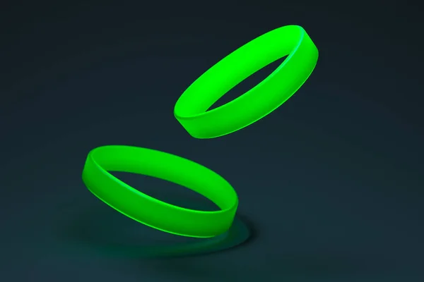Neonowe zielone gumowe bransoletki na ciemnym tle. Elastyczne silikonowe opaski na nadgarstki z pustą przestrzenią. 3d Renderowanie — Zdjęcie stockowe
