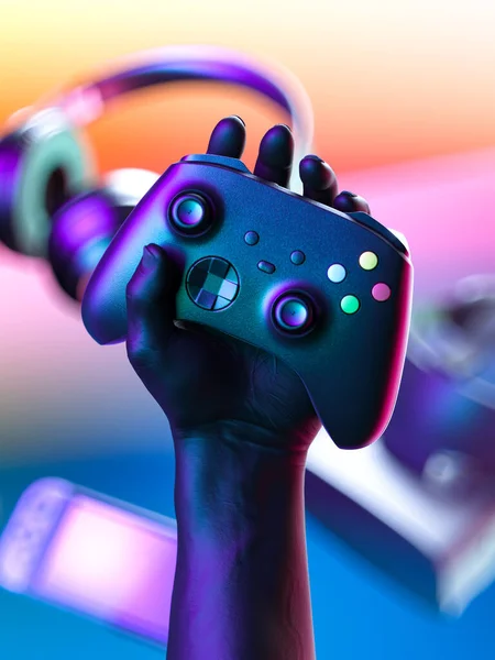 Hand hält drahtlosen Joystick mit Gamepad-Controller, VR-Brille, Kopfhörer, Videospielkonsole im Hintergrund. 3D-Darstellung — Stockfoto