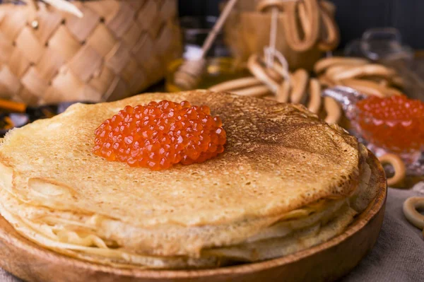 Shrovetide Maslenitsa Week festival meal. Stack of russian pancakes with red caviar. Rustic style, free space for text. Copy space — Stock Photo, Image