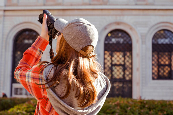  Woman traveling and taking pictures outdoors. Photographer Traveling Attractions Walk Hobby Vacation Concept. Nice day in Europe. Copy space