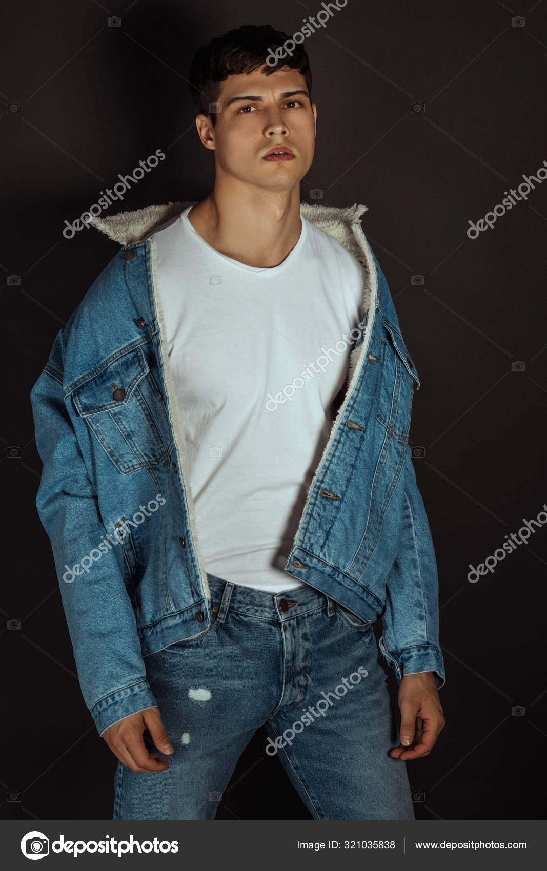 Premium Photo  Handsome young man in a denim jacket and white tshirt with  torn jeans walking in nature