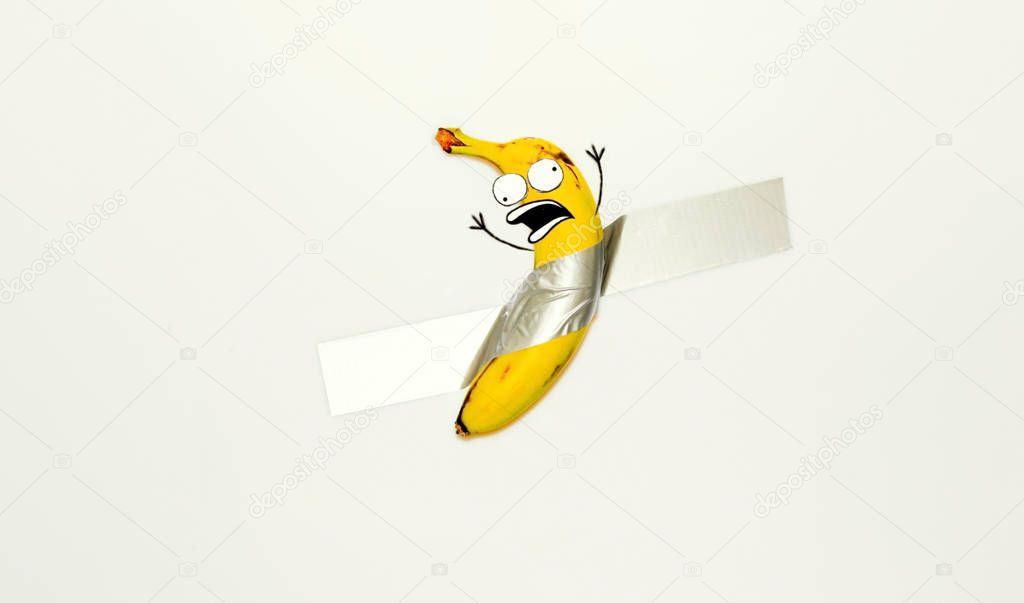 Banana human taped frightened and confused with drowed emotions and eyes face and hands 