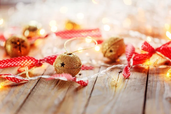 Metal Jingle Bells and Christmas Garland Light .  background — Stock Photo, Image