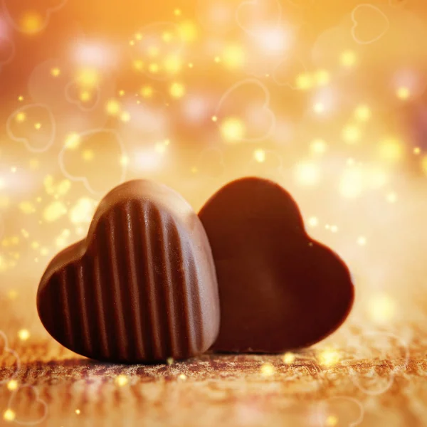 Two sweet chocolates hearts on a wooden background. Valentines day concept — Stock Photo, Image