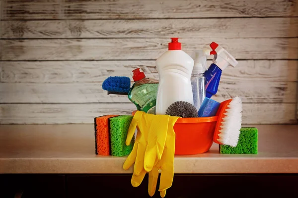 Cleaning set with products and supplies on kitchen table — Stock Photo, Image