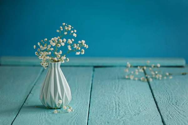 Baby's breath - gypsophilia paniculata - in vase on blue background — Stock Photo, Image