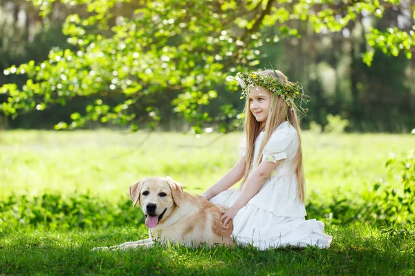LIttle girl and big dog bestfriend on nature background
