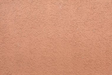 Pembe boyalı sıva duvar. Arka plan doku.
