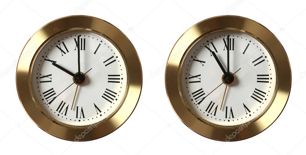 Two vintage clocks showing different time, isolated on white background