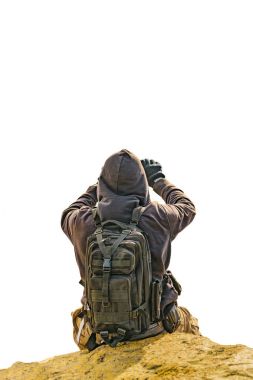 Rock izole fotoğrafa oturan fotoğraf çekmek adam