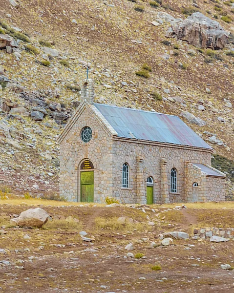 Small church surrounded by arid landsacpe mountain, las heras, mendoza province, argentina