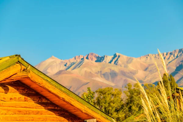 Wood cabin at outdoor andean landscape, uspallata town, mendoza province, argentina