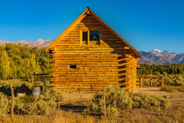 Wood cabin at outdoor andean landscape, uspallata town, mendoza province, argentina