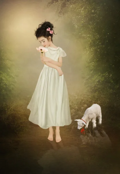 Das kleine Mädchen und das Lamm — Stockfoto