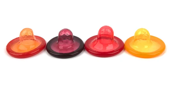 Изолированные цветные презервативы — стоковое фото