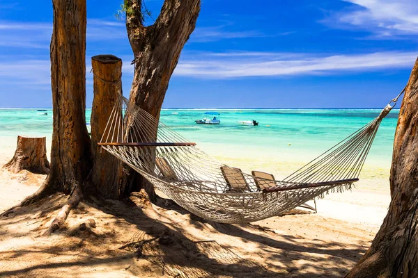 Tropical holidays - relax in hammock on the beach — Stock Photo, Image