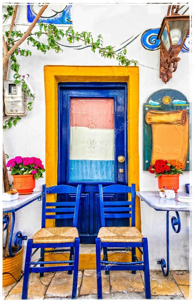 Traditional street colorful bars and tavernas of Greece