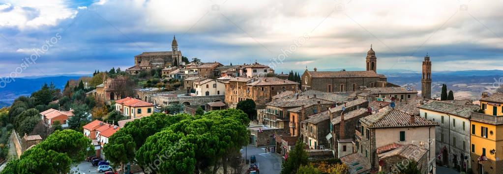 Landmarks of Italy - medieval town Montalcino over sunset. Tuscany.