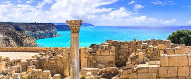 Landmarks of Cyprus island  - antique Kourion Temple over beautiful turquoise sea. clipart
