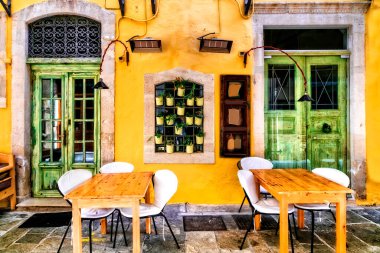 Renkli geleneksel Yunanistan serisi - Girit adasının Rethymno kentindeki küçük sokak restoranları (tavernalar).