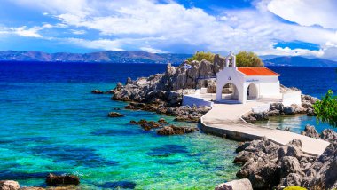 Authentic traditional Greek islands- unspoiled Chios, View  of little church in the sea over the rocks , Agios Isidoros clipart