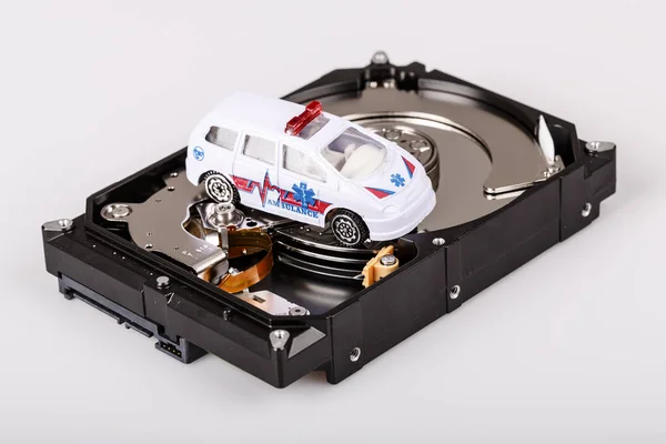 Ambulance car on harddrive or hdd - data rescue concept — Stock Photo, Image