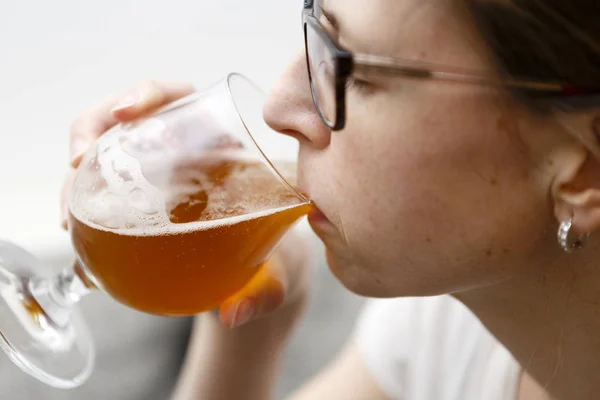 Young woman drinks beer - lager — Stock Photo, Image