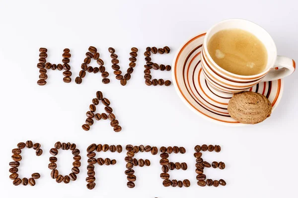 Have a coffee break from beans on white with cup of coffee — Stock Photo, Image