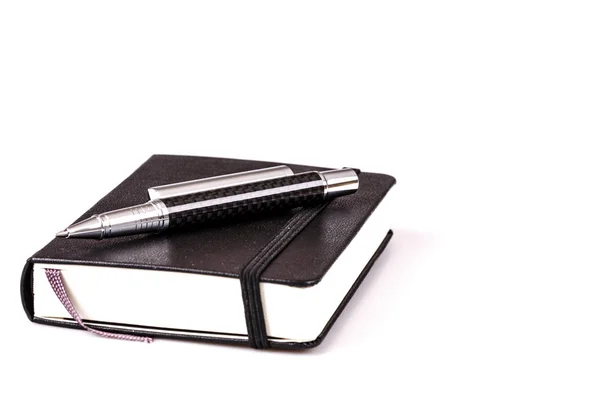 Pen and diary or planner on white — Stock Photo, Image