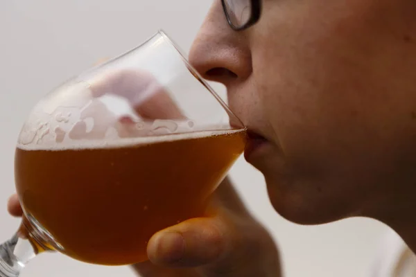 Young woman drinks beer - lager — Stock Photo, Image