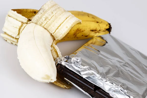 Banane et chocolat sur blanc Images De Stock Libres De Droits