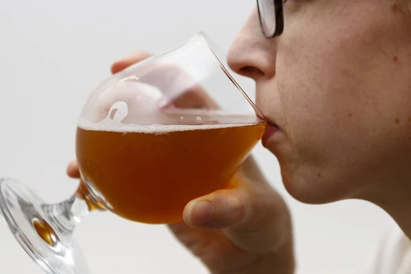 Young woman drinks beer - lager — Stock Photo, Image