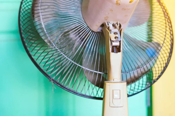 Close up to the old plastic joints of the electronic fan damaged and broken with a blurred background. Selective focus