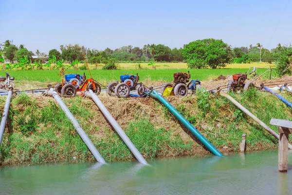 Row of water pump on trailer used to pump water from irrigation canal to enter agricultural areas