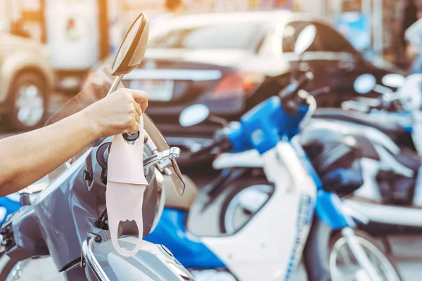 Hand Woman Picking Mask Hung Motorcycle Handle Prevent Germs Covid — Stock Photo, Image