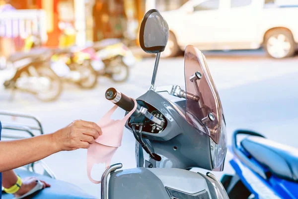 Hand Woman Picking Mask Hung Motorcycle Handle Prevent Germs Covid — Stock Photo, Image