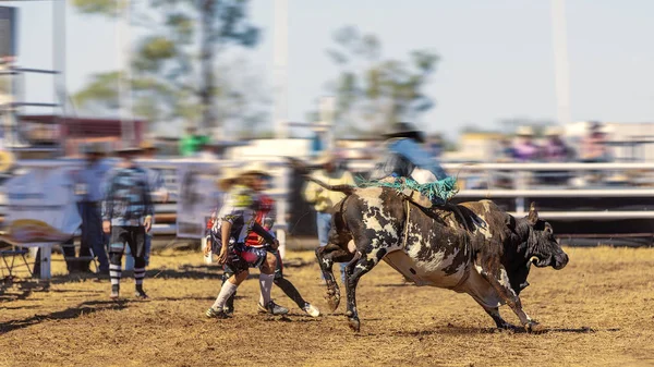 A Cowboy Riding A Bucking Bull At Rodeo — Stock fotografie