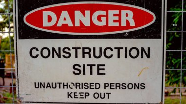 Danger sign on a construction site to keep unauthorised persons out clipart