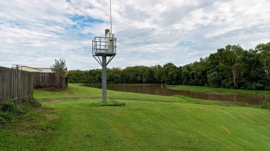 River flood alert network tower to warn of approaching flooding danger to people and property clipart