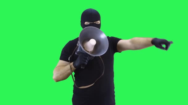 A man in a balaclava,shouting at a shout,green screen background. — Stock Video