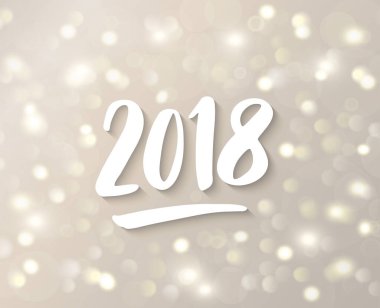 2018 çekilen numaralar el. Beyaz ve altın parlayan ışıklar pırıl pırıl. Bokeh etkisi ile tatil arka plan.